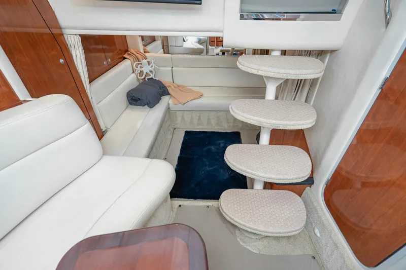 Slide: The Image of Interior of 2007 Sea Ray 340 Sundancer yacht with plush seating and spiral staircase. - 46