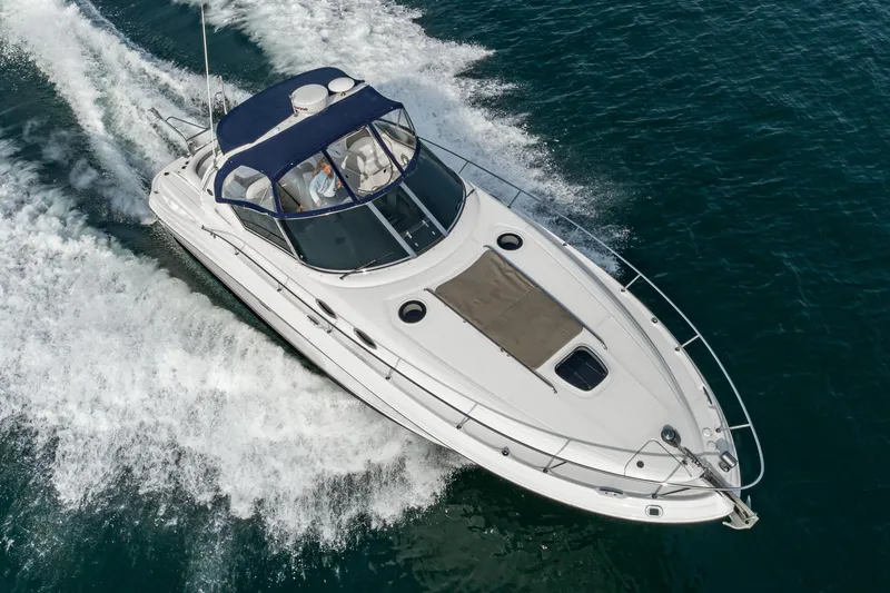 Slide: The Image of 2007 Sea Ray 340 Sundancer cruising on open water, showcasing sleek design and performance. - 5