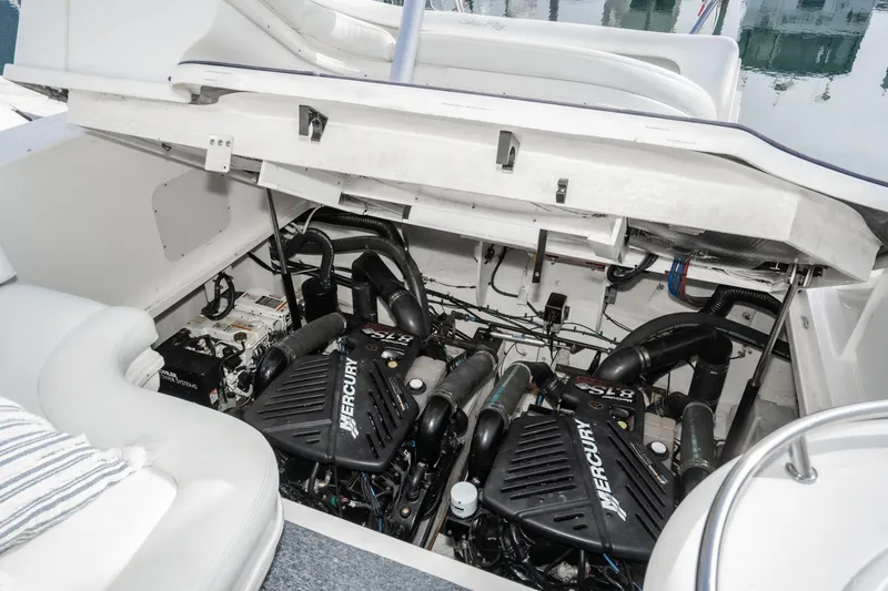 Slide: The Image of Engine compartment of a 2007 Sea Ray 340 Sundancer with Mercury engines visible. - 53