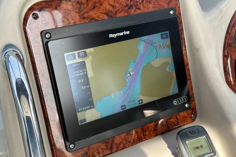 Slide: The Image of Raymarine navigation display on 2007 Sea Ray 340 Sundancer boat dashboard. - 58