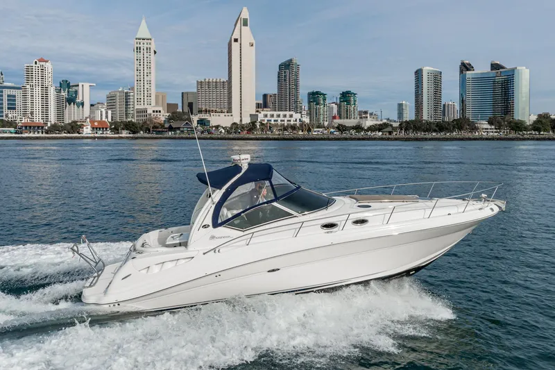Slide: The Image of 2007 Sea Ray 340 Sundancer cruising near city skyline on a sunny day. - 7