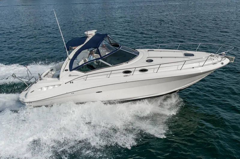 Slide: The Image of 2007 Sea Ray 340 Sundancer cruising on open water. - 9