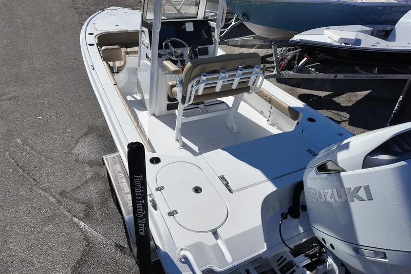 Slide: The Image of 2026 Blazer Bay 2440 boat with Suzuki engine, docked at marina. - 3