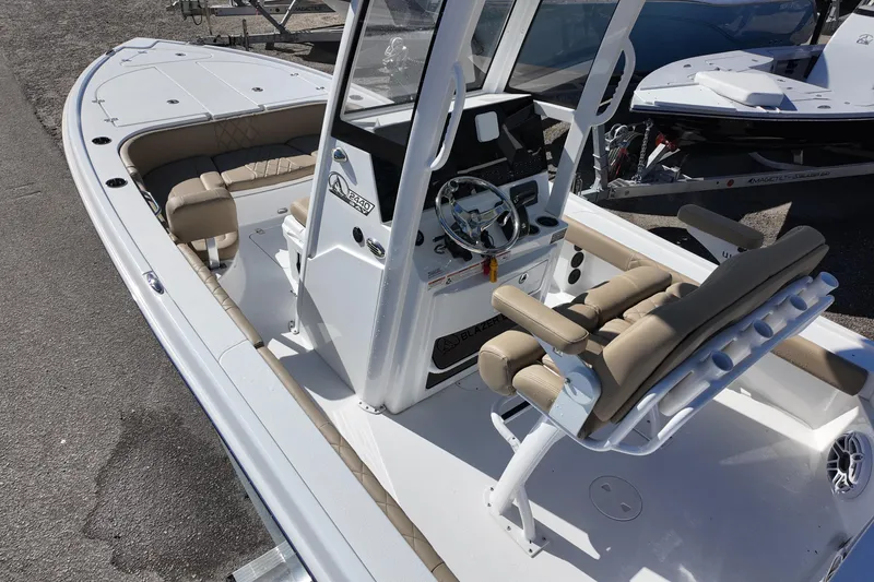 Slide: The Image of 2026 Blazer Bay 2440 boat with beige seating and modern console design. - 4