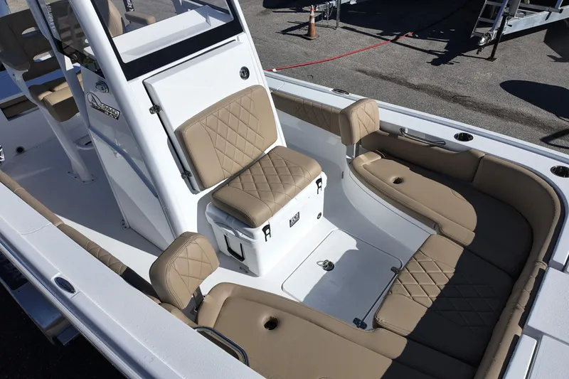 Slide: The Image of 2026 Blazer Bay 2440 boat interior with tan quilted seating and modern design. - 8