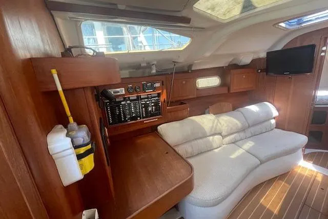Slide: The Image of Interior of 2001 Hunter 380 yacht with wooden finish and cozy seating area. - 10