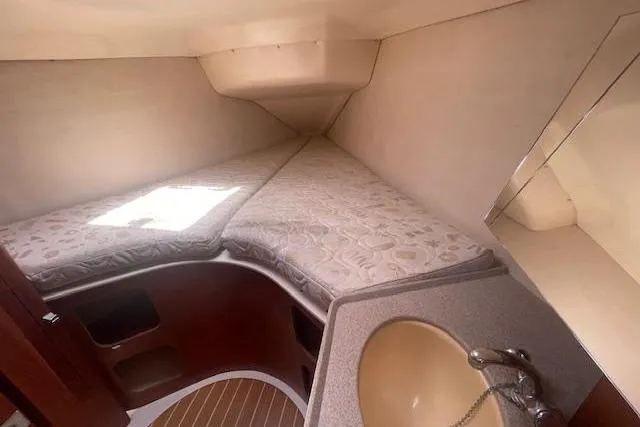 Slide: The Image of Interior cabin of 2001 Hunter 380 sailboat with bed and sink. - 18