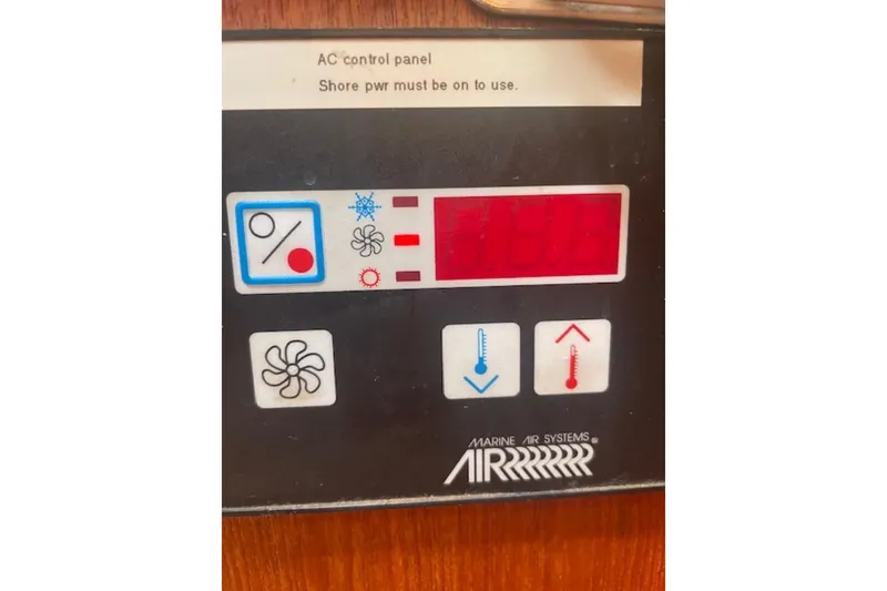 Slide: The Image of Control panel of a 2001 Hunter 380 boat, displaying temperature and fan settings. - 19