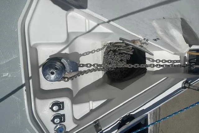 Slide: The Image of Anchor chain and windlass on a 2001 Hunter 380 sailboat deck. - 29