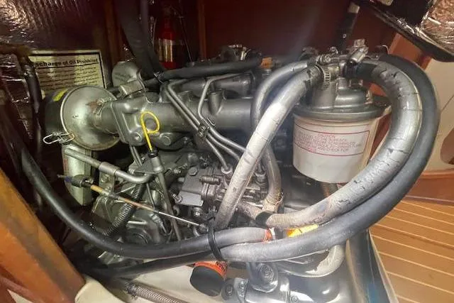 Slide: The Image of Engine compartment of a 2001 Hunter 380 sailboat, showcasing intricate mechanical components. - 30