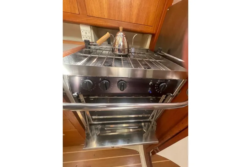Slide: The Image of Stainless steel stove with kettle in a 2001 Hunter 380 yacht kitchen. - 6