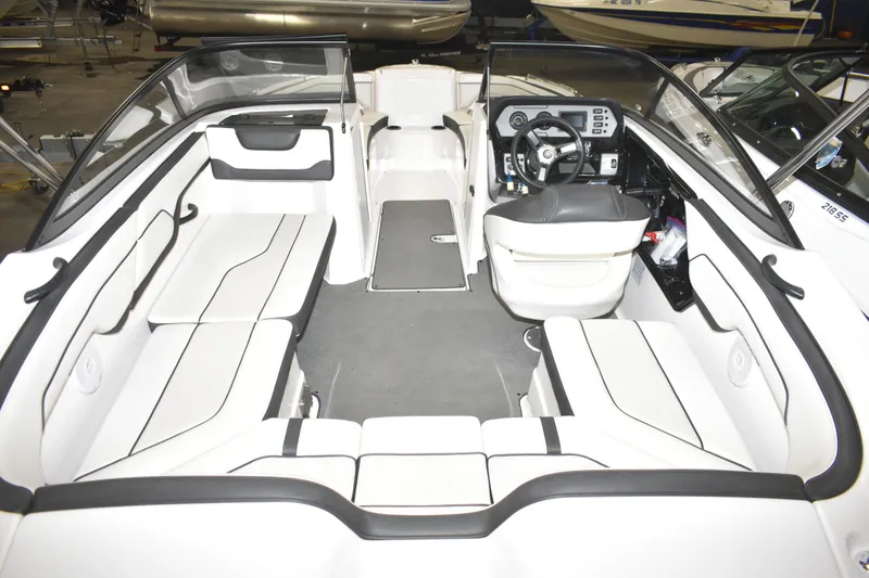 Slide: The Image of 2017 Yamaha SX210 boat interior with white seating and modern dashboard. - 5