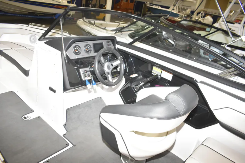 Slide: The Image of 2017 Yamaha SX210 boat interior with steering wheel and dashboard controls. - 7