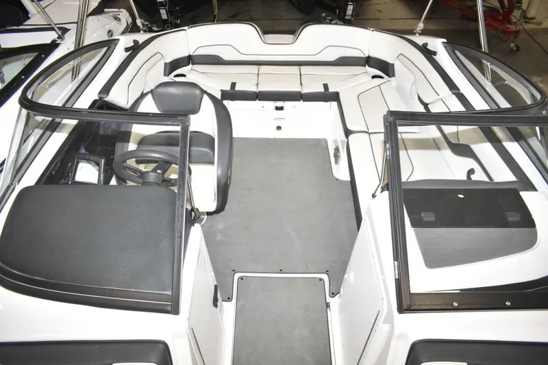 Slide: The Image of 2017 Yamaha SX210 boat interior with spacious seating and sleek design. - 9