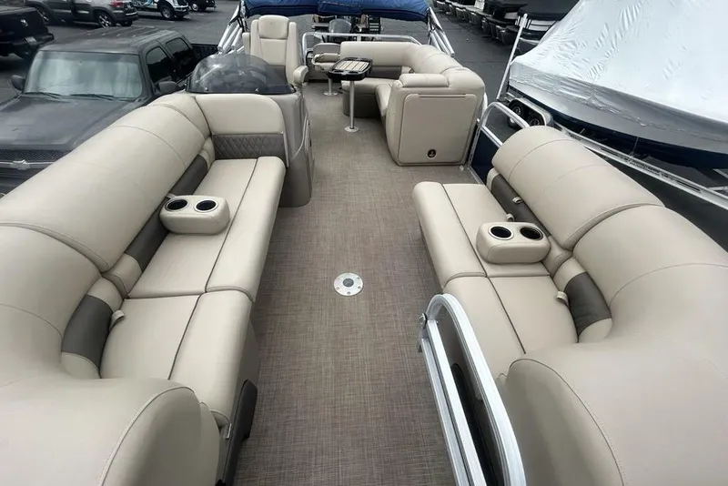 Slide: The Image of 2021 Sun Tracker SportFish 22 DLX pontoon boat with spacious seating and cup holders. - 17