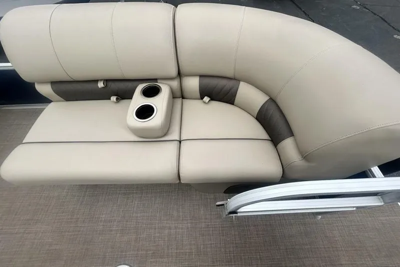 Slide: The Image of 2021 Sun Tracker SportFish 22 DLX boat seating with cup holders, beige upholstery. - 7