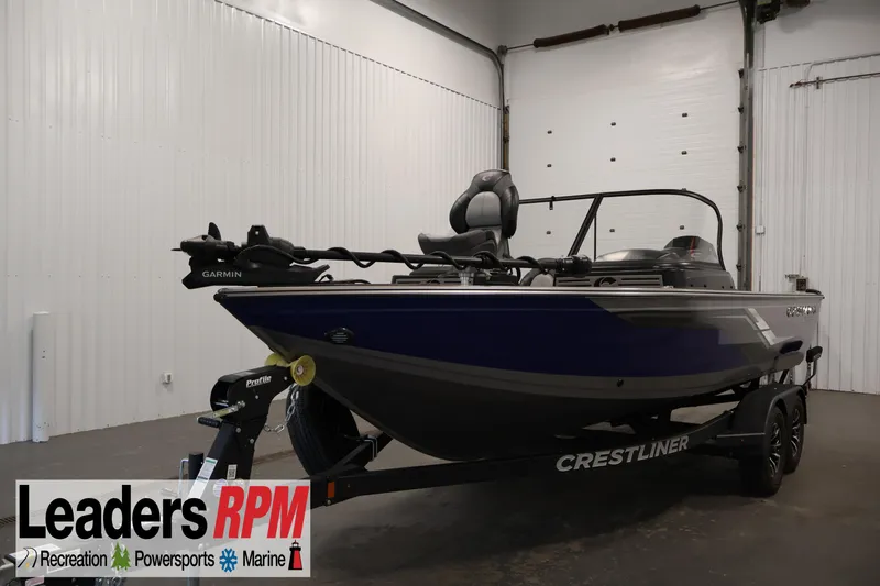 The Image of 2025 Crestliner 1950 Fish Hawk WT boat in showroom, featuring Garmin equipment. - 1