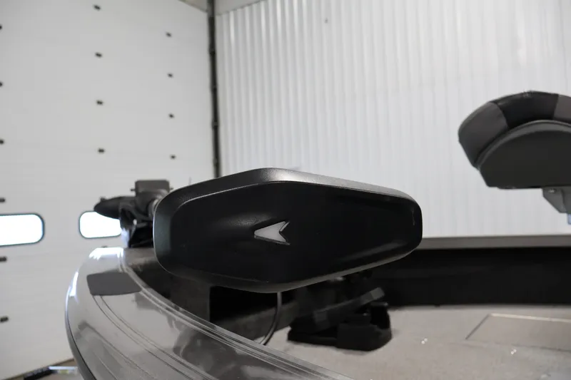 Slide: The Image of 2025 Crestliner 1950 Fish Hawk WT boat interior with seating and equipment in a garage setting. - 11