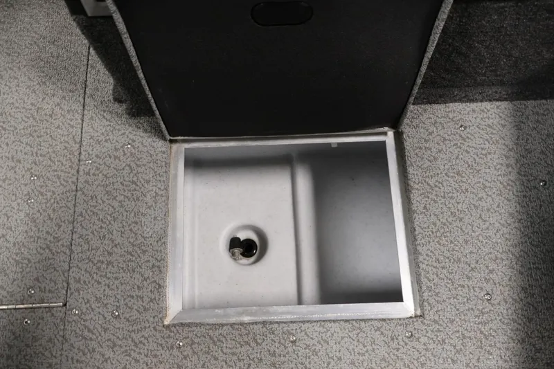 Slide: The Image of Storage compartment in 2025 Crestliner 1950 Fish Hawk WT boat, featuring durable interior design. - 17