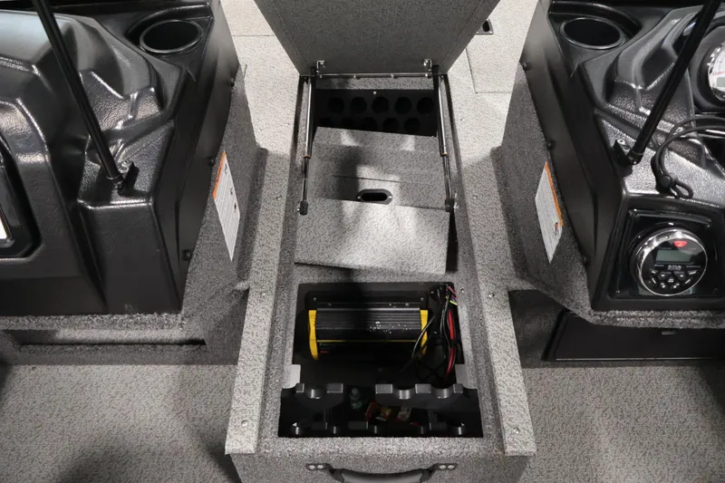 Slide: The Image of 2025 Crestliner 1950 Fish Hawk WT interior storage compartment with electronic components and cup holders. - 20