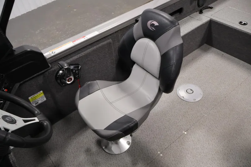 Slide: The Image of 2025 Crestliner 1950 Fish Hawk WT boat interior with a sleek, modern captain's chair. - 28