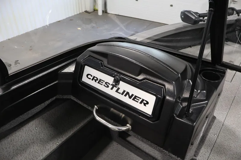 Slide: The Image of 2025 Crestliner 1950 Fish Hawk WT dashboard with logo, sleek black design. - 29