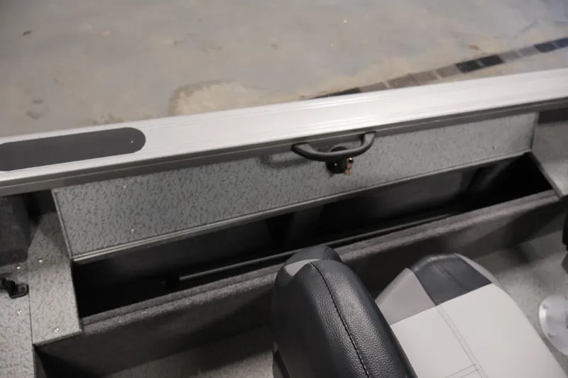 Slide: The Image of 2025 Crestliner 1950 Fish Hawk WT interior with storage compartment and seating. - 32