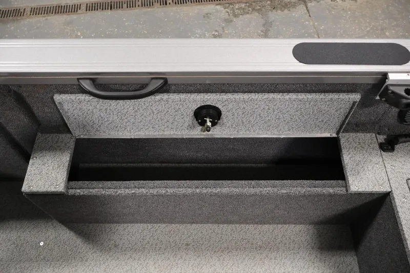 Slide: The Image of 2025 Crestliner 1950 Fish Hawk WT interior storage compartment with textured finish. - 33