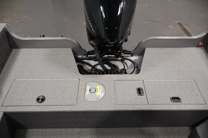 Slide: The Image of 2025 Crestliner 1950 Fish Hawk WT boat interior with motor and storage compartments. - 34