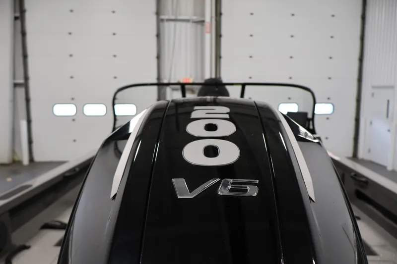 Slide: The Image of 2025 Crestliner 1950 Fish Hawk WT with 200 V6 engine in a garage setting. - 40