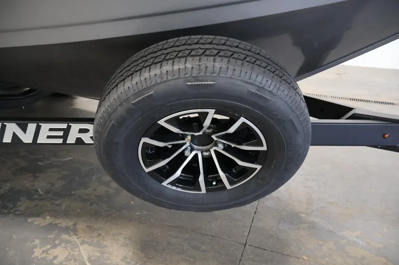 Slide: The Image of Trailer wheel of 2025 Crestliner 1950 Fish Hawk WT boat on concrete floor. - 43