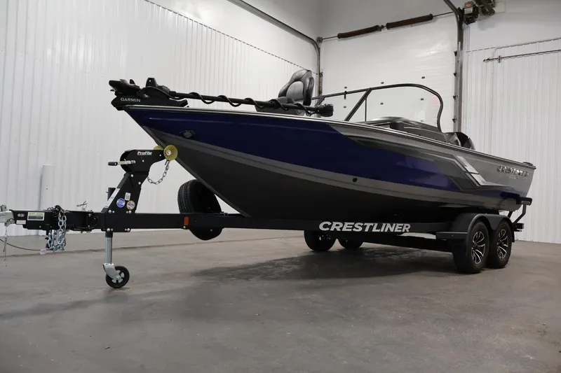 Slide: The Image of 2025 Crestliner 1950 Fish Hawk WT boat on trailer in indoor setting. - 44