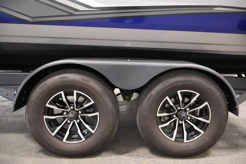 Slide: The Image of 2025 Crestliner 1950 Fish Hawk WT trailer wheels, featuring sleek black and silver rims. - 45