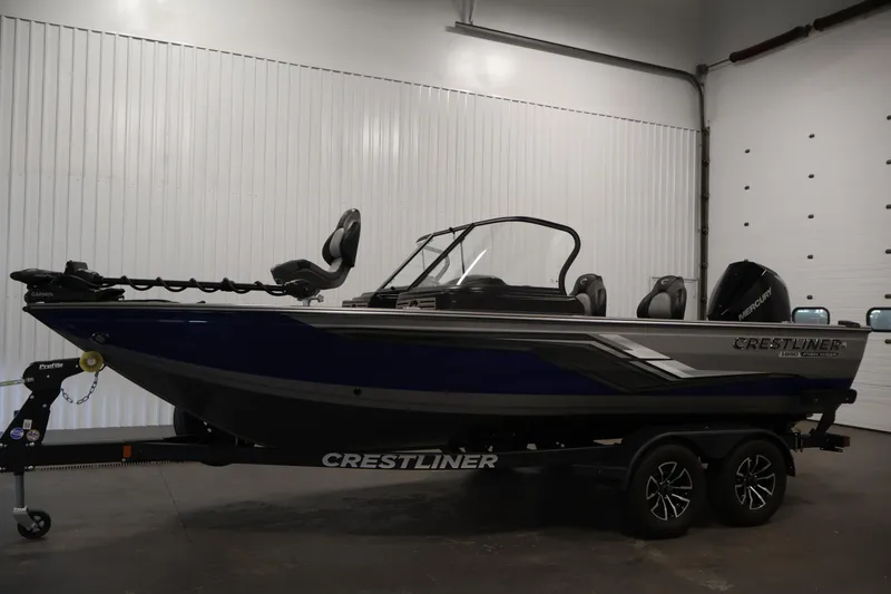 Slide: The Image of 2025 Crestliner 1950 Fish Hawk WT boat in indoor showroom, side view. - 8