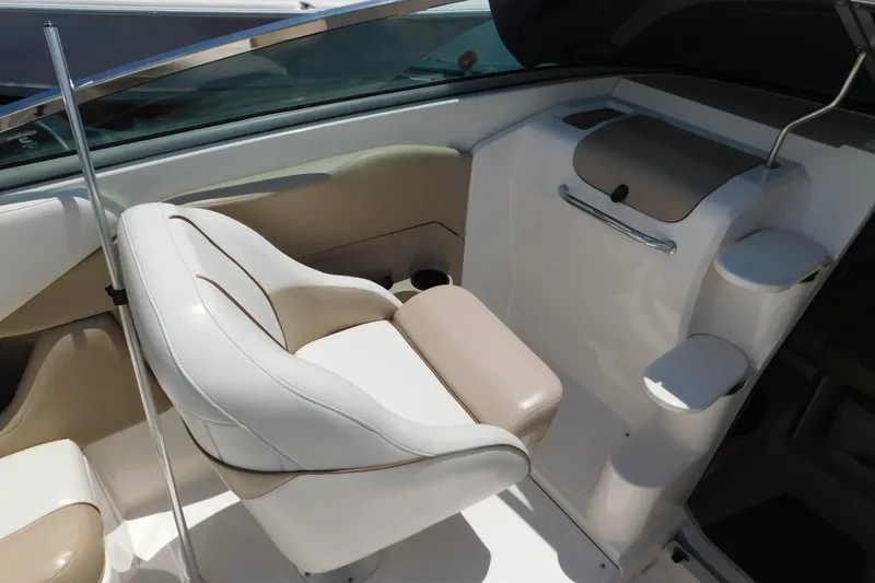 Slide: The Image of 2004 Regal 2250 LSC boat interior with beige and white seating. - 13