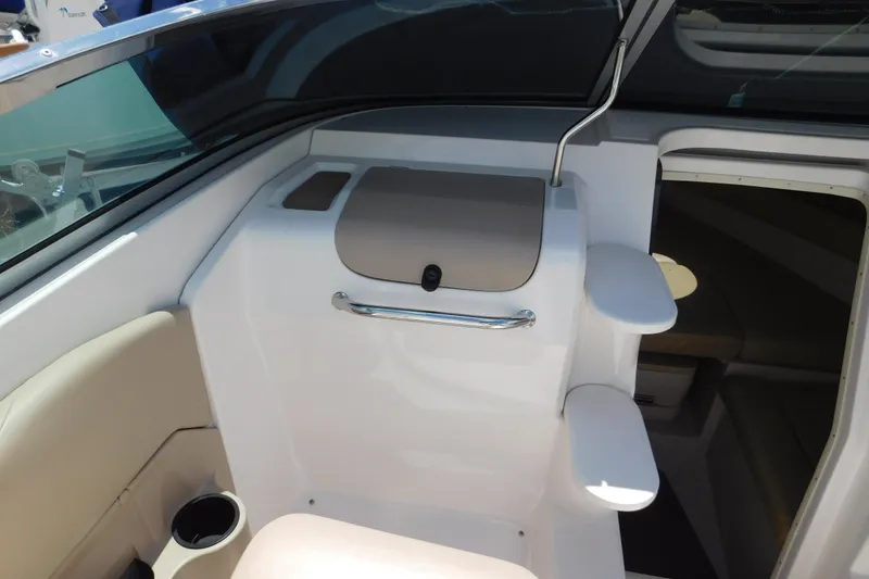 Slide: The Image of Interior view of a 2004 Regal 2250 LSC boat, featuring seating and storage. - 17