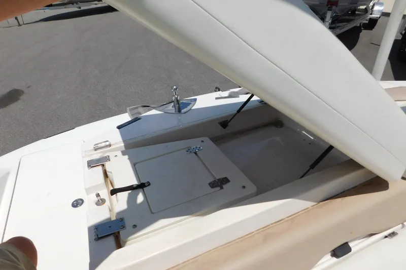 Slide: The Image of 2004 Regal 2250 LSC boat with open storage compartment on deck. - 25