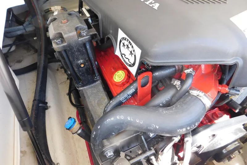 Slide: The Image of Engine compartment of a 2004 Regal 2250 LSC boat, featuring Volvo Penta components. - 29