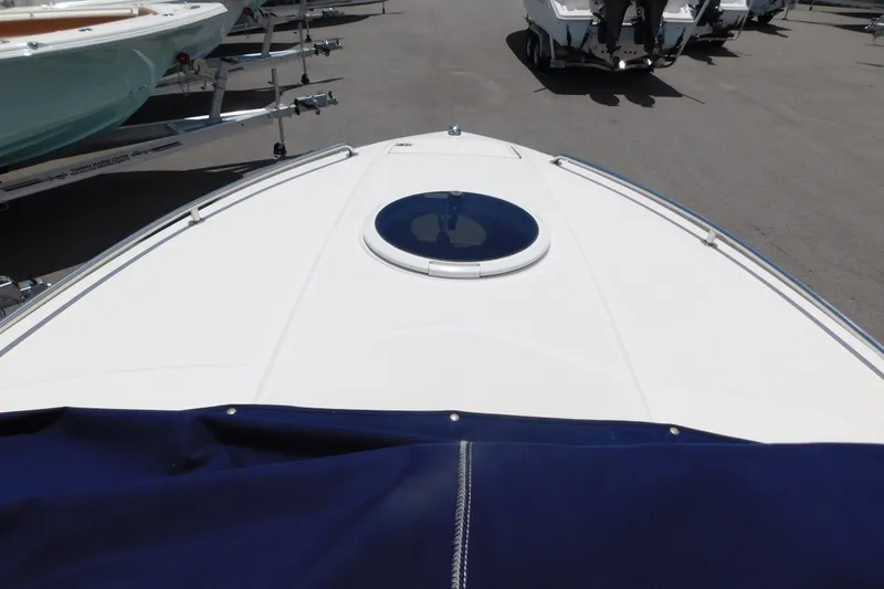 Slide: The Image of 2004 Regal 2250 LSC boat bow with hatch, parked on a trailer. - 30