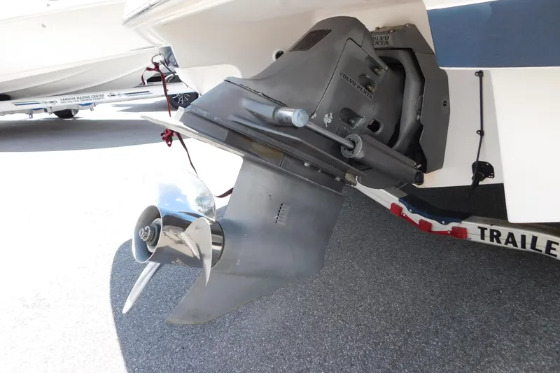 Slide: The Image of 2004 Regal 2250 LSC boat with Volvo Penta outdrive, parked on a trailer. - 6