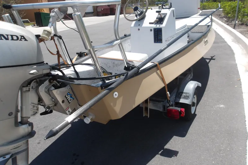 Slide: The Image of 2002 Gheenoe Classic 15 boat on trailer with Honda outboard motor. - 4