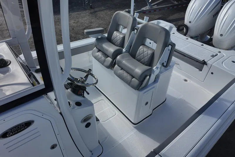 Slide: The Image of 2026 Blazer Bay Makaira 2800 boat interior with dual seats and steering console. - 13