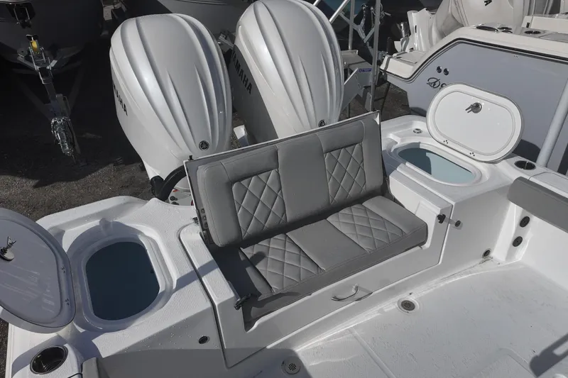 Slide: The Image of 2026 Blazer Bay Makaira 2800 boat with dual Yamaha engines and cushioned seating. - 15