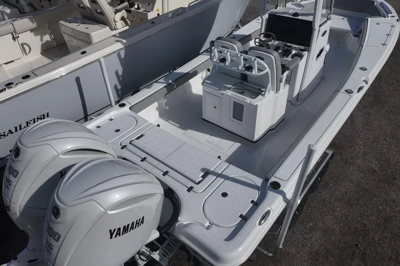 Slide: The Image of 2026 Blazer Bay Makaira 2800 boat with dual Yamaha engines, sleek design, and spacious deck. - 5