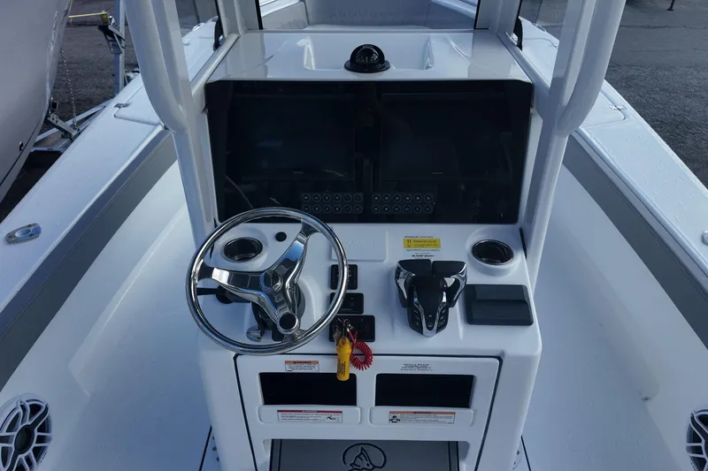 Slide: The Image of 2026 Blazer Bay Makaira 2800 boat console with steering wheel and controls. - 7