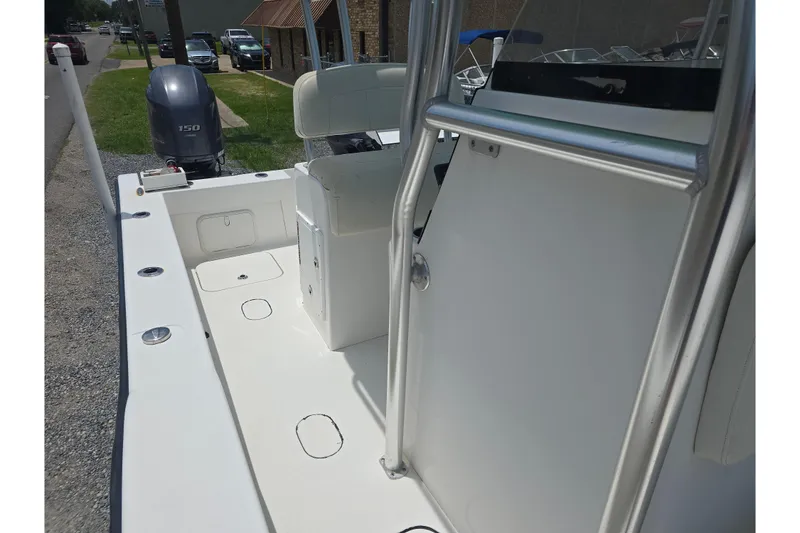 Slide: The Image of 2015 Tideline 235 boat interior with seating and outboard motor. - 10