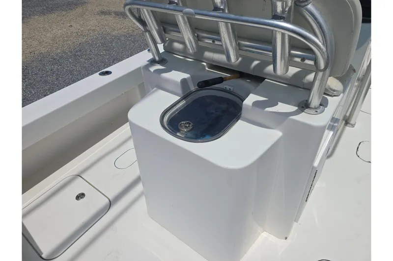 Slide: The Image of 2015 Tideline 235 boat interior with storage compartment and seating. - 14