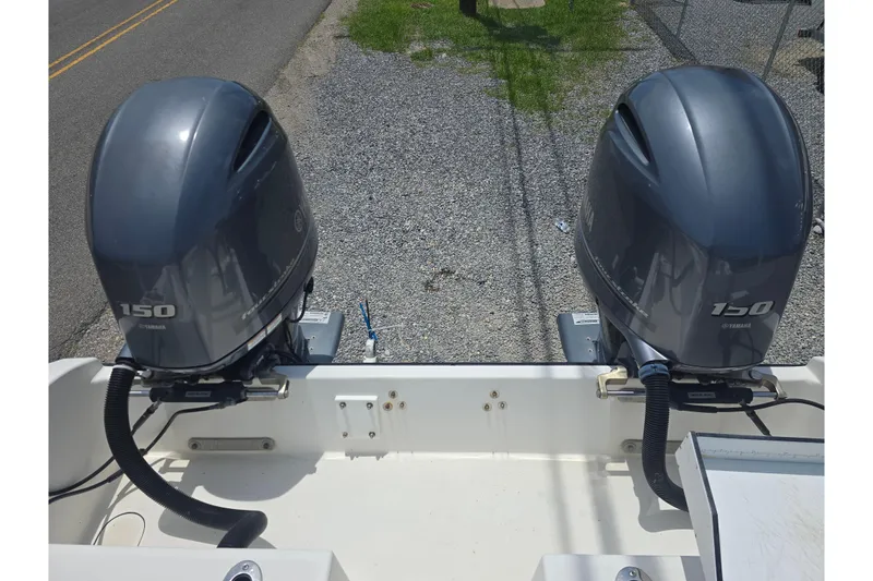 Slide: The Image of Twin Yamaha 150 outboard motors on a 2015 Tideline 235 boat. - 15