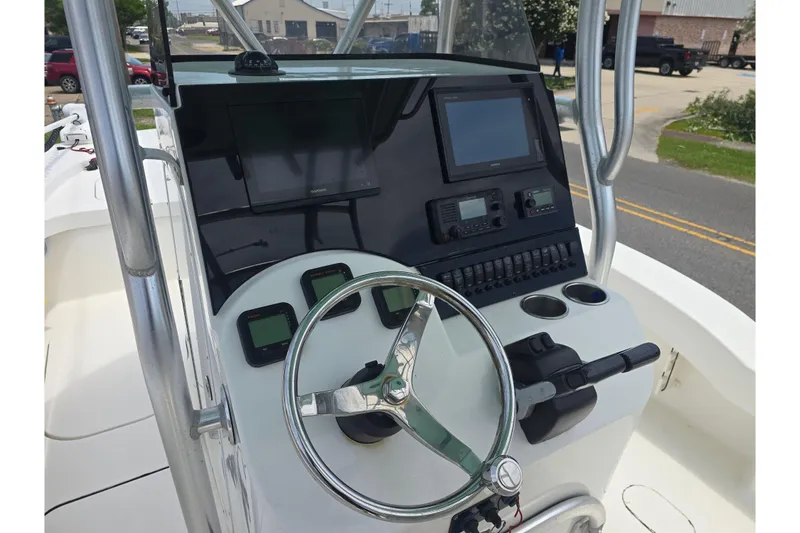 Slide: The Image of Steering console of a 2015 Tideline 235 boat with navigation equipment. - 7