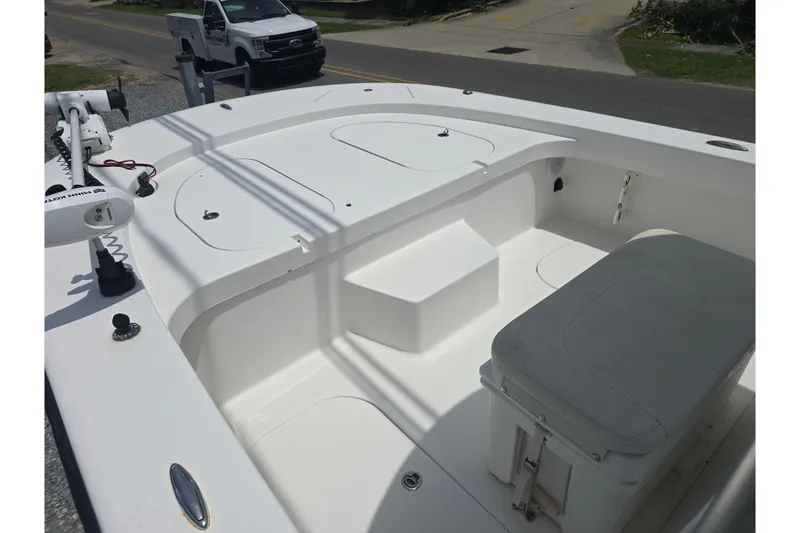 Slide: The Image of 2015 Tideline 235 boat interior with seating and storage compartments. - 8